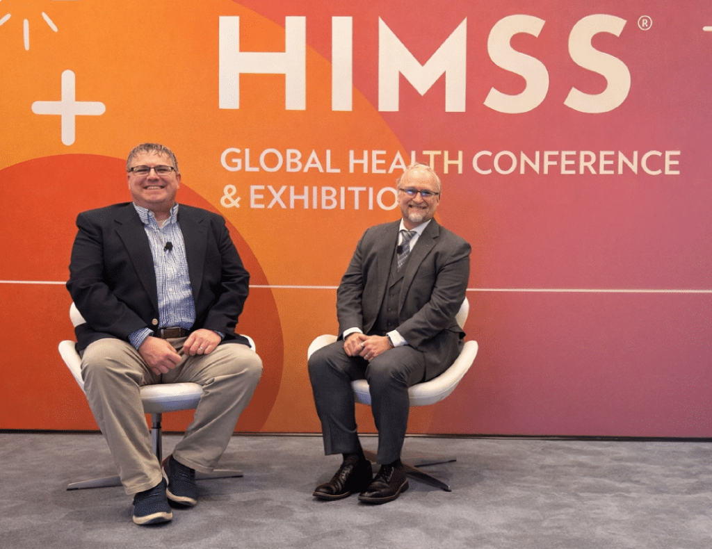 Two speakers at HIMSS Global Health Conference Q&A discussing AI in healthcare